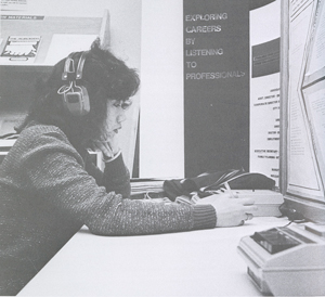Unidentified student at desk with headphones