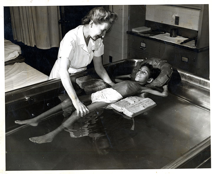 Irmgard with boy in pool