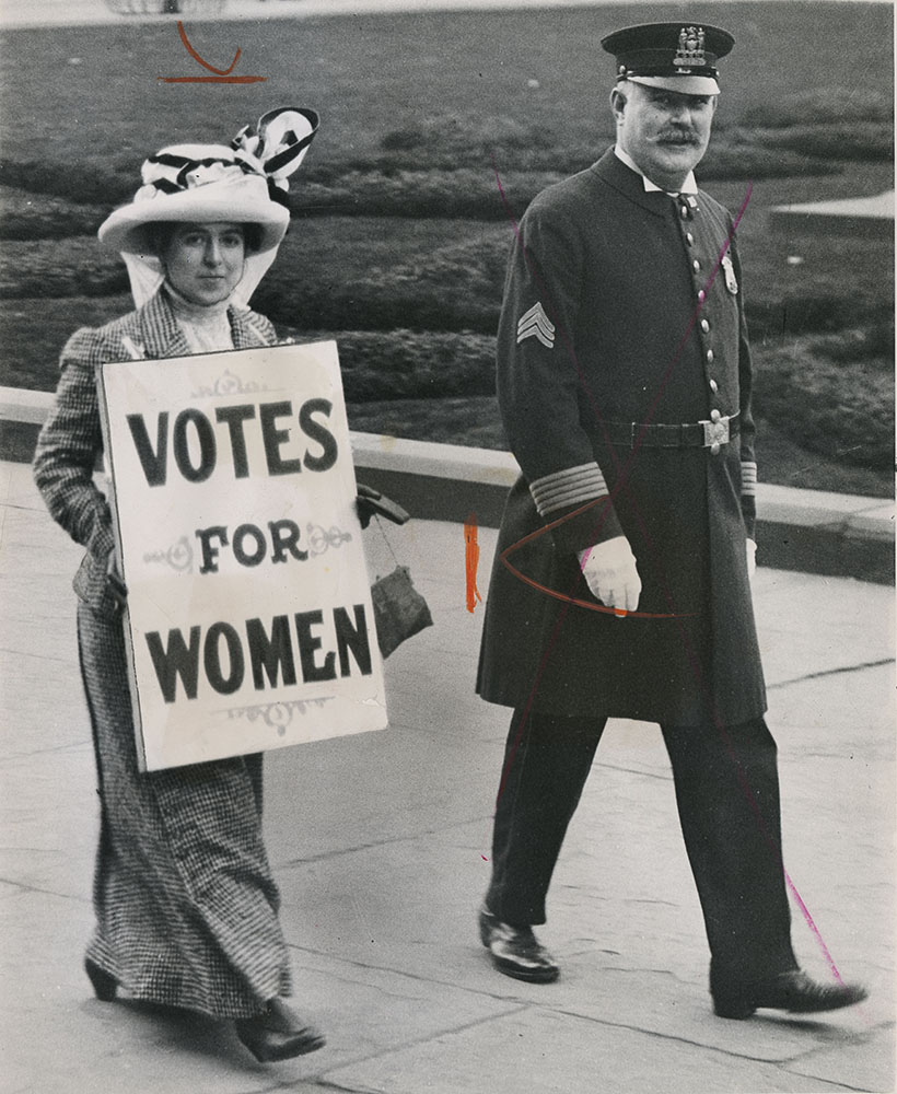 Suffragist with police officer