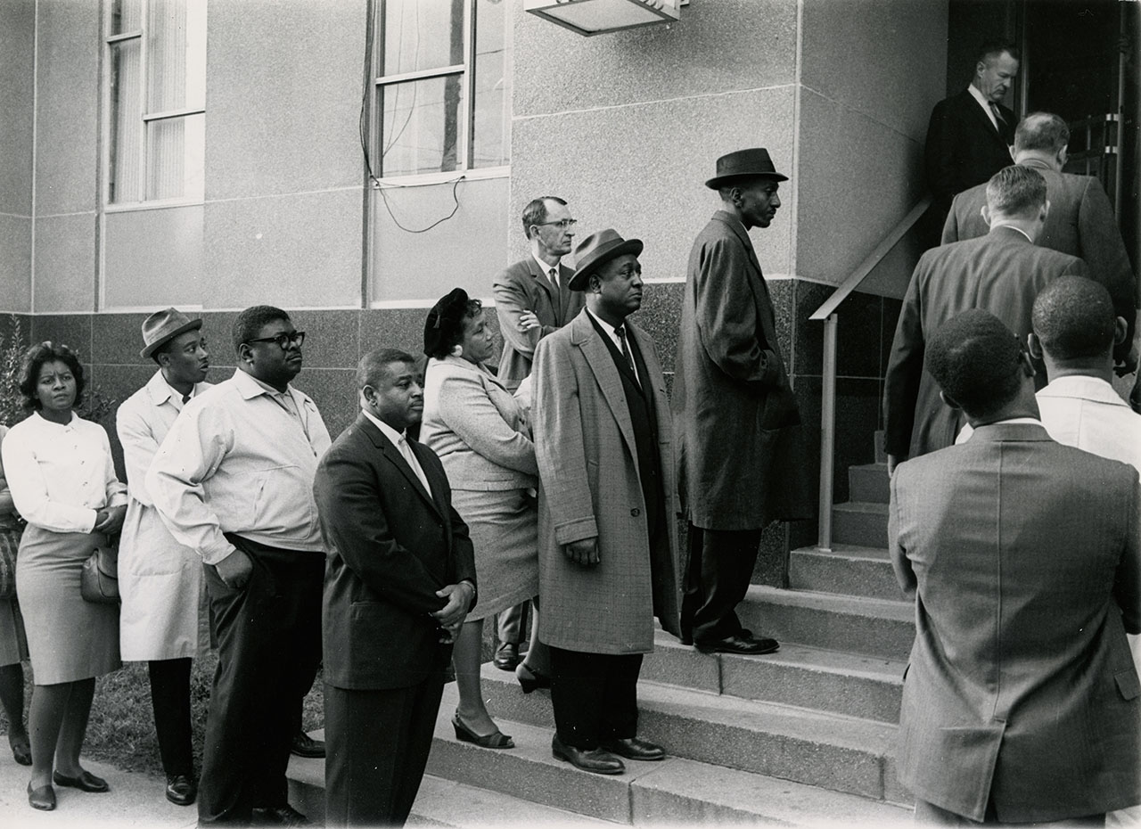 Line of people outside registration office