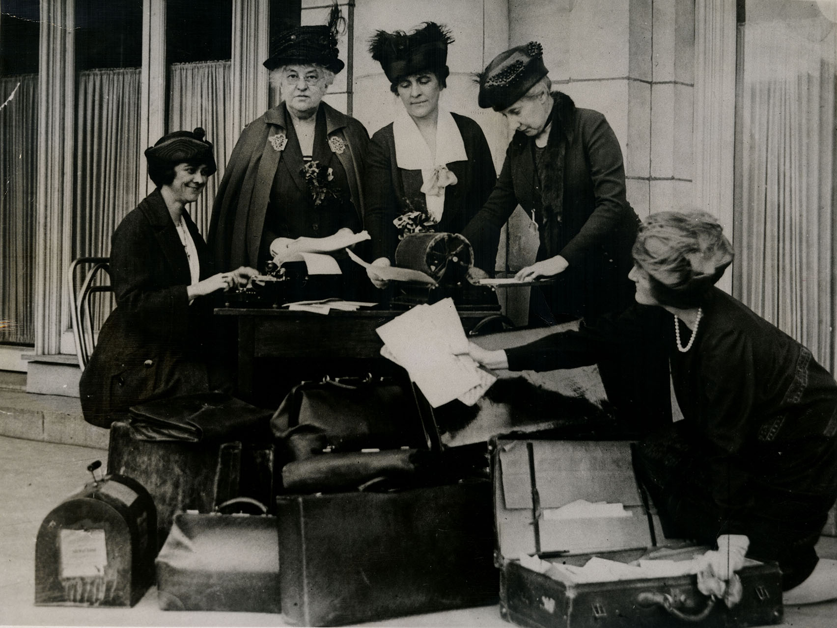 League of Women Voters members with suitcases