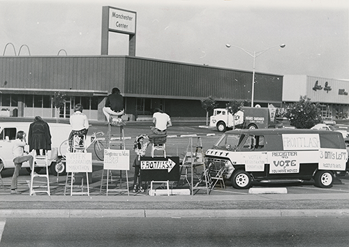 Frontlash roadside van and ladders with numerous posters to register to vote