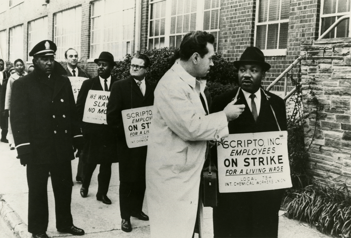 Dr. Martin Luther King, Jr. joins a picket line in support of a strike by the International Chemical Workers Union