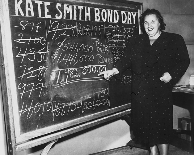 Kate Smith standing in front of chalkboard on Bond Day