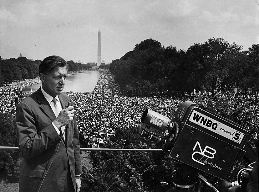 Ray Sherer standing in front of crowd in front the Washington Monument in Washington DC