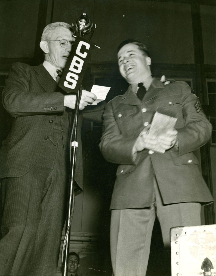 Photo of Sgt. John L. Berlew being interviewed by Parks Johnson