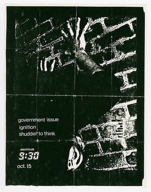 Government Issue flyer with a dark photo of a person's hands on a brick wall.