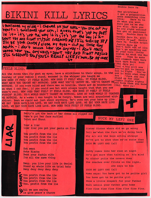 Bright red lyric sheet in black text (a mix of typed and written text).