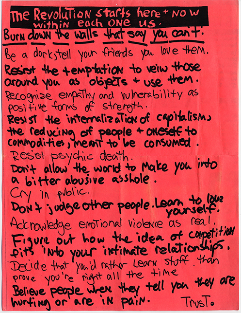 A handwritten poster with black writing on red paper. There are no images, only lines of text that take up the whole page.