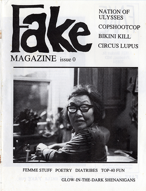 Fake, Issue 0 cover with a photo of an elderly Asian woman with glasses.