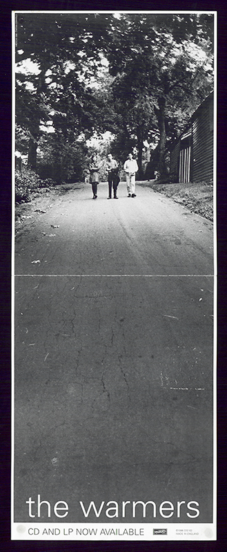 Long narrow black and white poster with a photograph of Amy Farina, Alec MacKaye, and Juan Luis Carrera walking down a driveway taking up the majority of the poster.